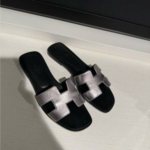 Authentic Hermes Oran sandals in silver and black